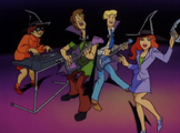 Velma wearing a witch hat in Scooby-Doo and the Witch's Ghost, an instance of Velma wearing witch-like clothing in Scooby-Doo media.