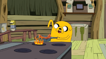 Jake singing "Bacon Pancakes" while cooking said food in "Burning Low".