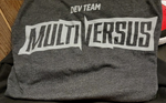 The dark gray MultiVersus Dev Team shirt (courtesy of @AJAX_HQ on Twitter).[2]