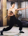 Bruce Lee with nunchucks, as seen in Fist of Fury.