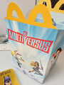 The Australian boxart for the MultiVersus-themed Happy Meal (courtesy of u/HeadbangingLegend on r/MultiVersusTheGame).