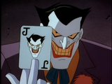 A screencap of The Joker brandishing a card from Batman: The Animated Series.